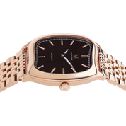 Rose gold watch with black dial on a white background