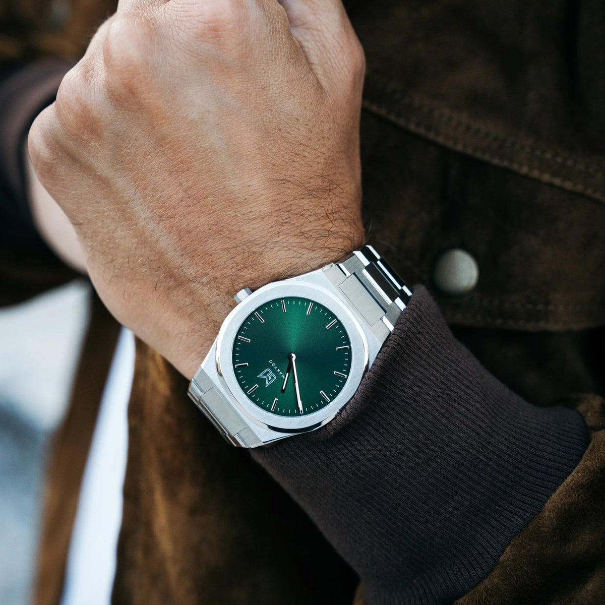 A slim dress watch built to sit close to the wrist