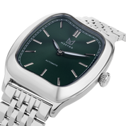 Silver watch with green dial on a white background