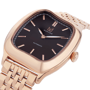 Rose gold watch with black dial on a white background