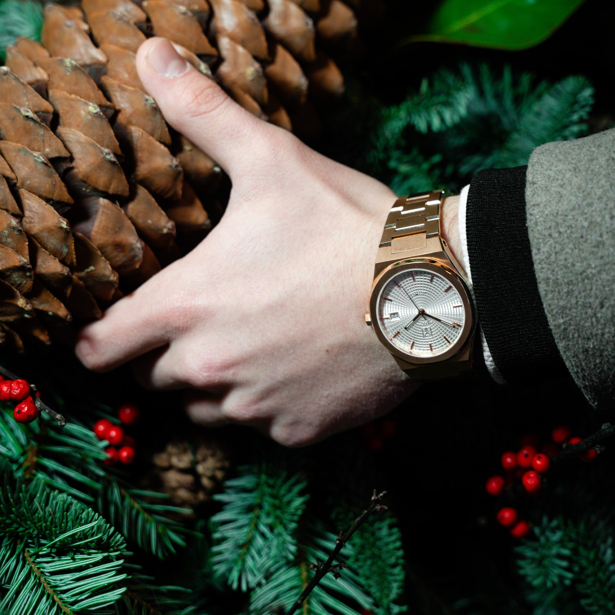 Wrist shot of man wearing MAKYDO Rose Gold white Mosaic 38 automatic unisex watch, featuring green mosaic pattern dial.  316L Stainless Steel integrated bracelet complimented with a 9mm of slim case powered by a sturdy Japan MIYOTA 9015 movement.