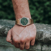 Wrist shot of man wearing MAKYDO Rose Gold Green Mosaic 38 automatic unisex watch, featuring green mosaic pattern dial.  316L Stainless Steel integrated bracelet complimented with a 9mm of slim case powered by a sturdy Japan MIYOTA 9015 movement.