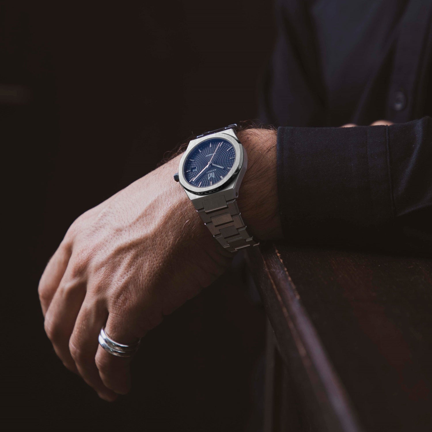 Wrist shot of a man wearing MAKYDO Classy Blue Mosaic 38 automatic unisex watch, featuring blue mosaic pattern dial.  316L Stainless Steel integrated bracelet complimented with a 9mm of slim case powered by a sturdy Japan MIYOTA 9015 movement.