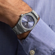 Wrist shot of MAKYDO Mystic Blue 38 automatic unisex watch, featuring a light blue sunburst  dial.  316L Stainless Steel integrated bracelet complimented with a 9mm of slim case powered by a sturdy Japan MIYOTA 9015 movement.