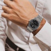Wrist shot of MAKYDO Onyx Black Middle East 38 automatic unisex watch, featuring a black  sunburst  dial with arabic numerals as indices.  316L Stainless Steel integrated bracelet complimented with a 9mm of slim case powered by a sturdy Japan MIYOTA 9015 movement.