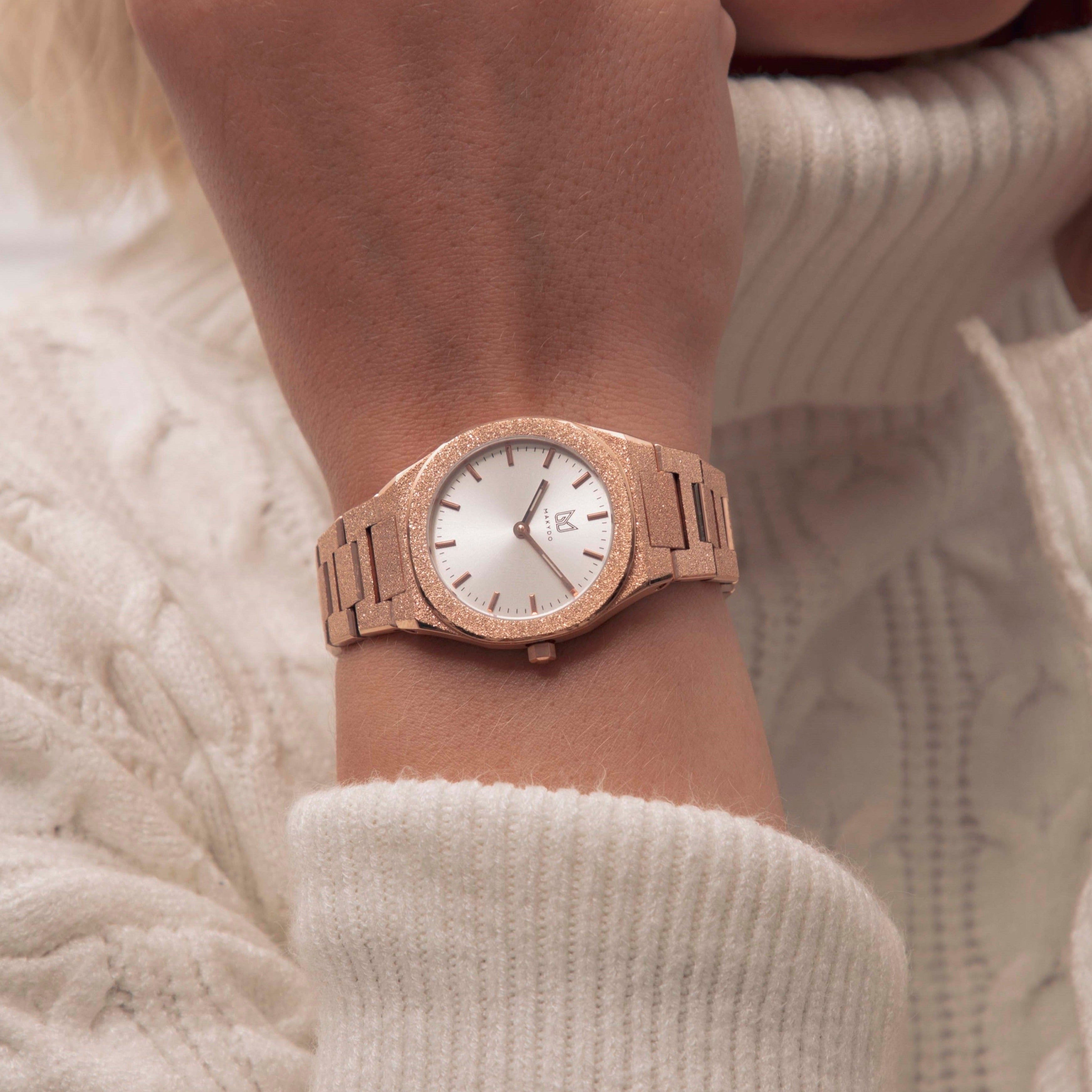 Behold the ethereal masterpiece that graces the wrist—the rose gold-plated frosted finish pearl white women's watch.  Each passing second inspires self-discovery, radiating resilience and passion.  The brilliant, highly transparent sapphire crystal with anti-reflective coating expose the sophisticated silver baton hands with BGW9 Lume. The flawless symmetry of the 316L Stainless Steel integrated bracelet complimented with a 6.7mm of slim case powered by a sturdy Miyota quartz movement.