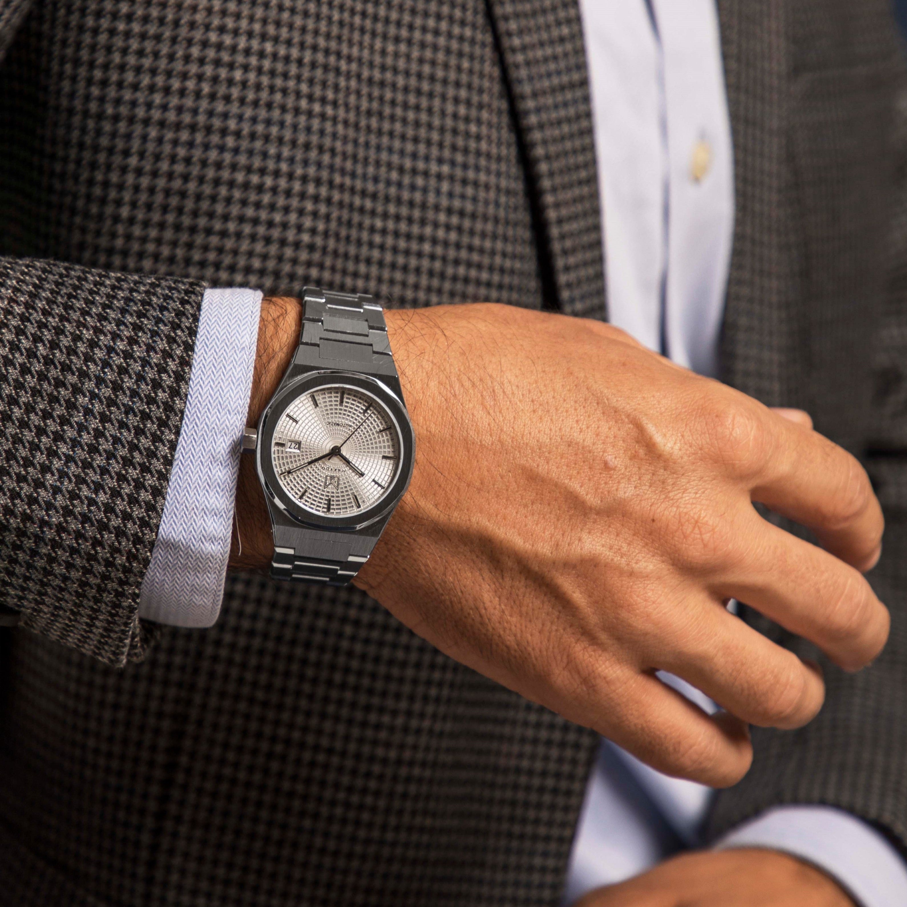 Wrist shot of MAKYDO Pearl White Mosaic 38 automatic unisex watch, featuring white mosaic pattern dial.  316L Stainless Steel integrated bracelet complimented with a 9mm of slim case powered by a sturdy Japan MIYOTA 9015 movement.