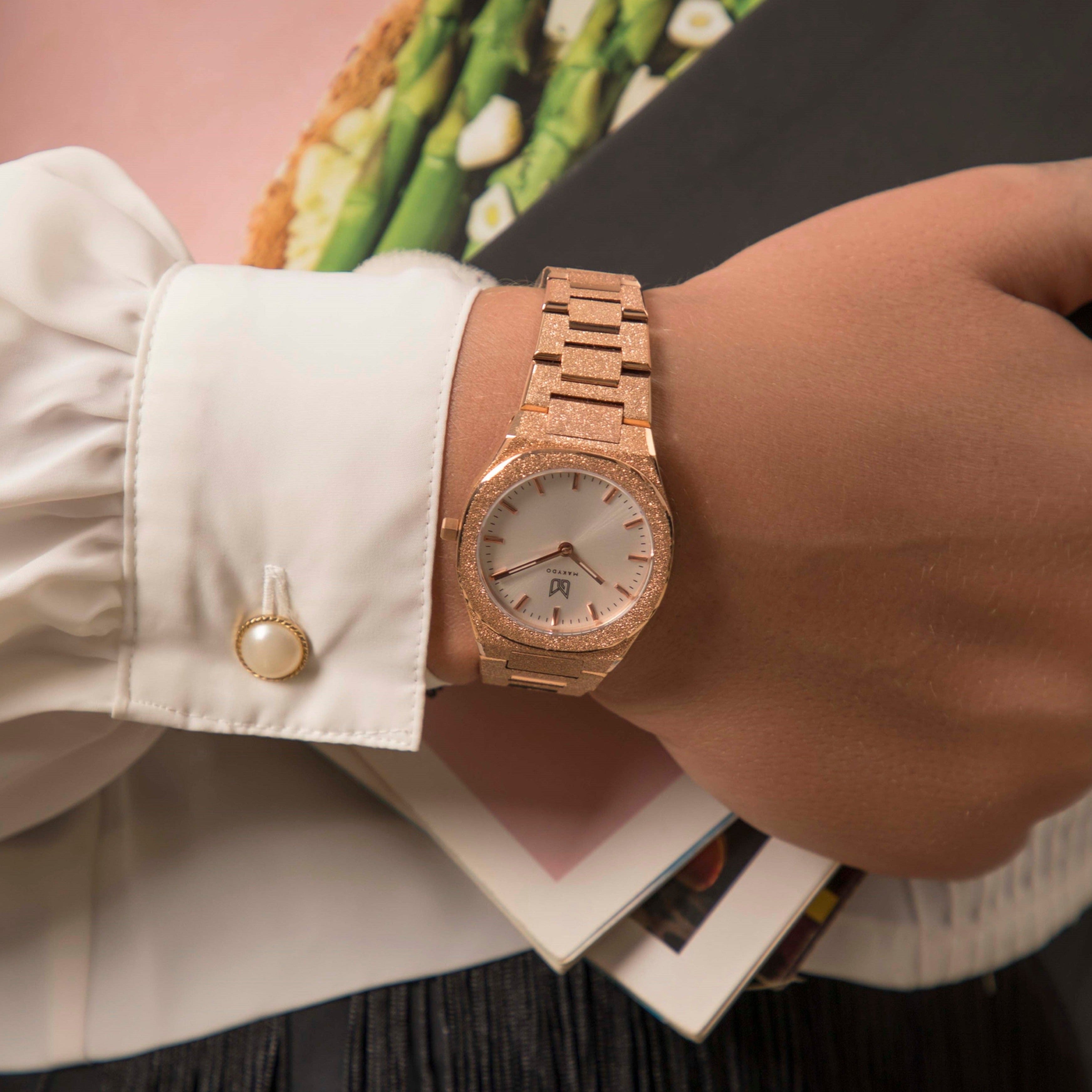 Behold the ethereal masterpiece that graces the wrist—the rose gold-plated frosted finish pearl white women's watch.  Each passing second inspires self-discovery, radiating resilience and passion.  The brilliant, highly transparent sapphire crystal with anti-reflective coating expose the sophisticated silver baton hands with BGW9 Lume. The flawless symmetry of the 316L Stainless Steel integrated bracelet complimented with a 6.7mm of slim case powered by a sturdy Miyota quartz movement.