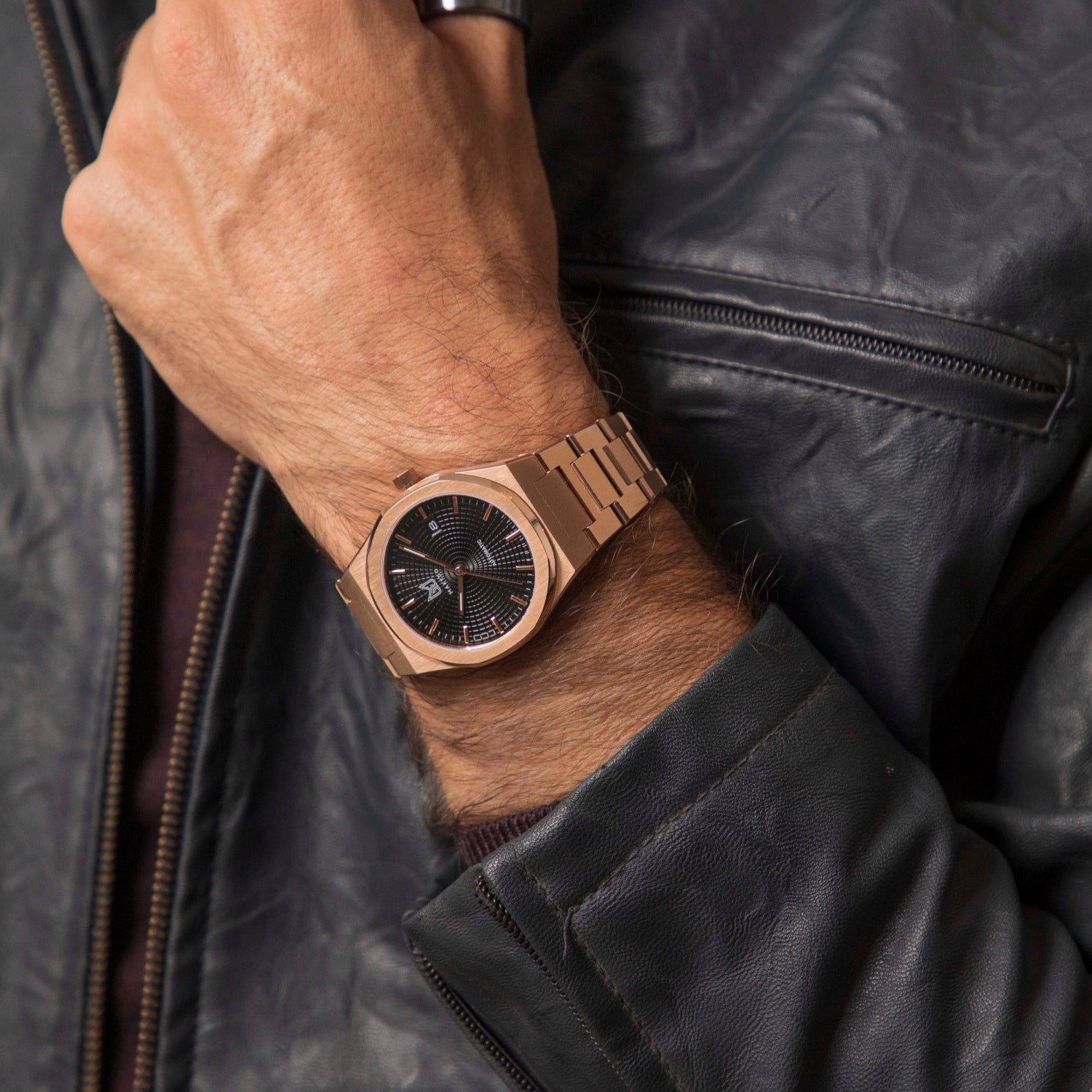 Wrist shot of man wearing MAKYDO Rose Gold Black Mosaic 38 automatic unisex watch, featuring green mosaic pattern dial.  316L Stainless Steel integrated bracelet complimented with a 9mm of slim case powered by a sturdy Japan MIYOTA 9015 movement.