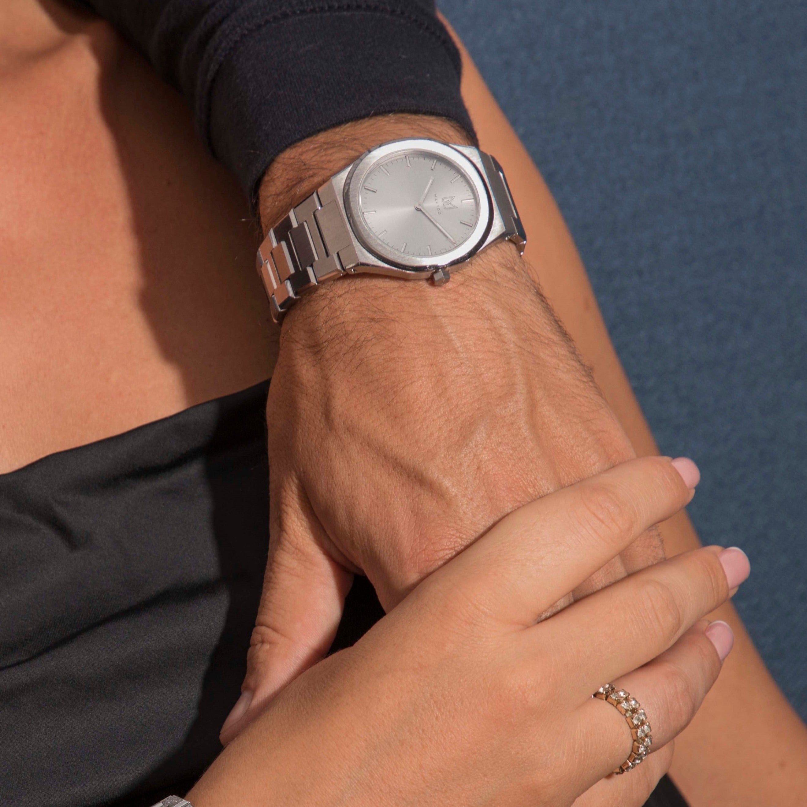 Within the harmonious tapestry of monochromatic ash grey men's watch, a melodic ensemble of subdued grays narrates a tale of unwavering strength and rejuvenation.  The brilliant, highly transparent sapphire crystal with anti-reflective coating expose the sophisticated silver baton hands with BGW9 Lume. The flawless symmetry of the 316L Stainless Steel  integrated bracelet complimented with a 6.7mm of slim case powered by a sturdy Miyota quartz movement.