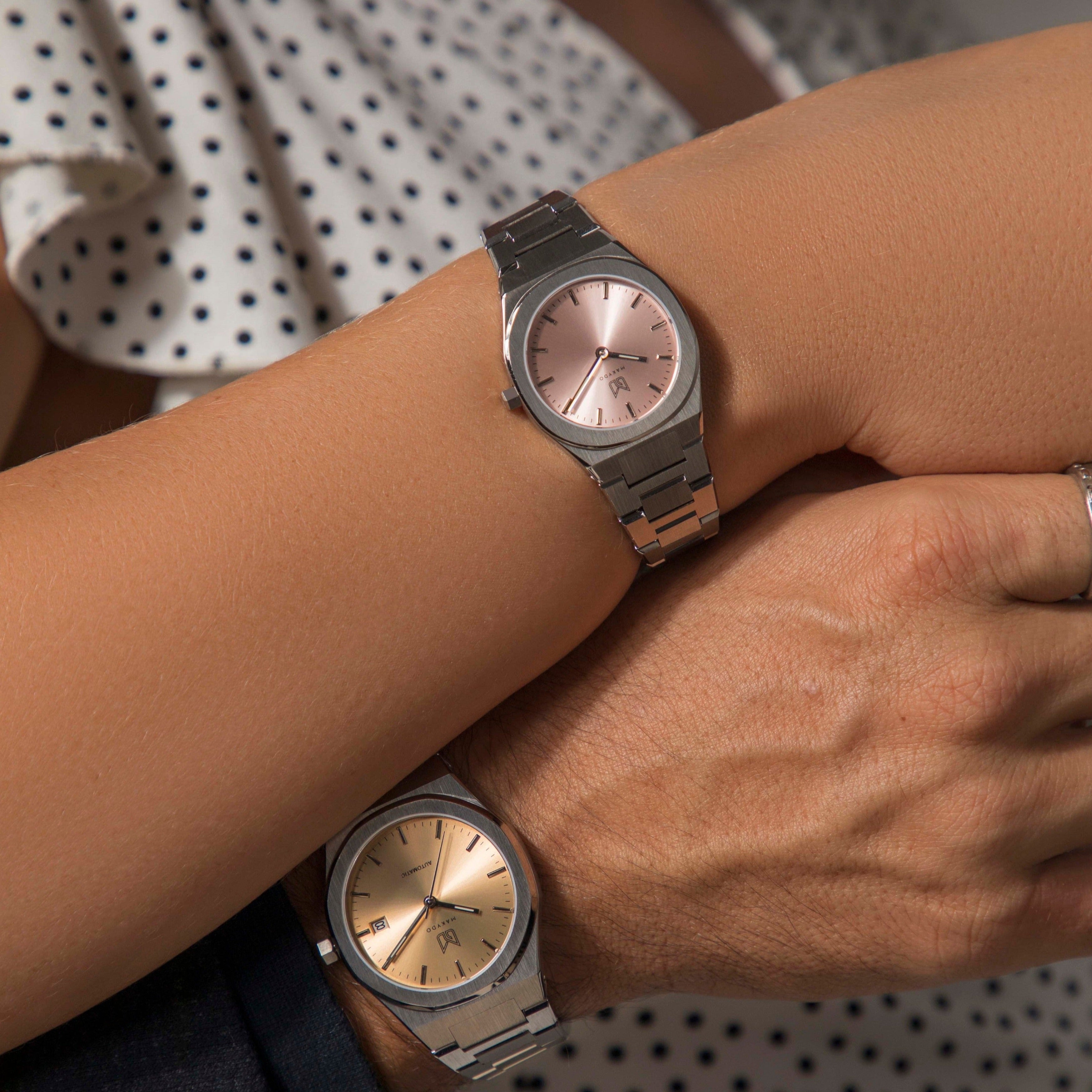 Unveil your captivating beauty with this Makydo women's watch, where strength and grace intertwine in perfect balance. The light pink dial, like a soft blush of dawn, emanates a tender radiance and kindling passions. The brilliant, highly transparent sapphire crystal with anti-reflective coating expose the sophisticated silver baton hands with BGW9 Lume. The flawless symmetry of the 316L Stainless Steel integrated bracelet complimented with a 6.7mm of slim case powered by a sturdy Miyota quartz movement.