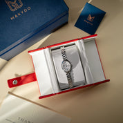 Silver watch in an open red and white box with Makydo branding.